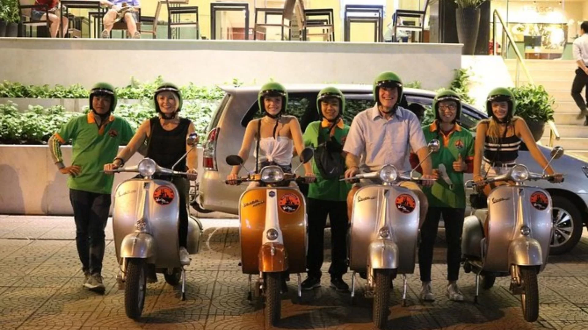 Join a Vespa night tour through the city
